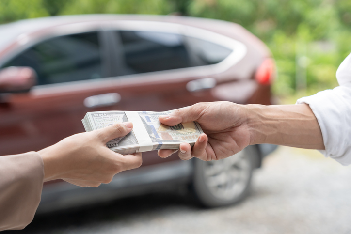 car being sold for a stack of cash
