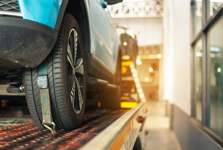 car on tow truck in for extended warranty repair