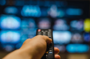 tv remote with blurry ads